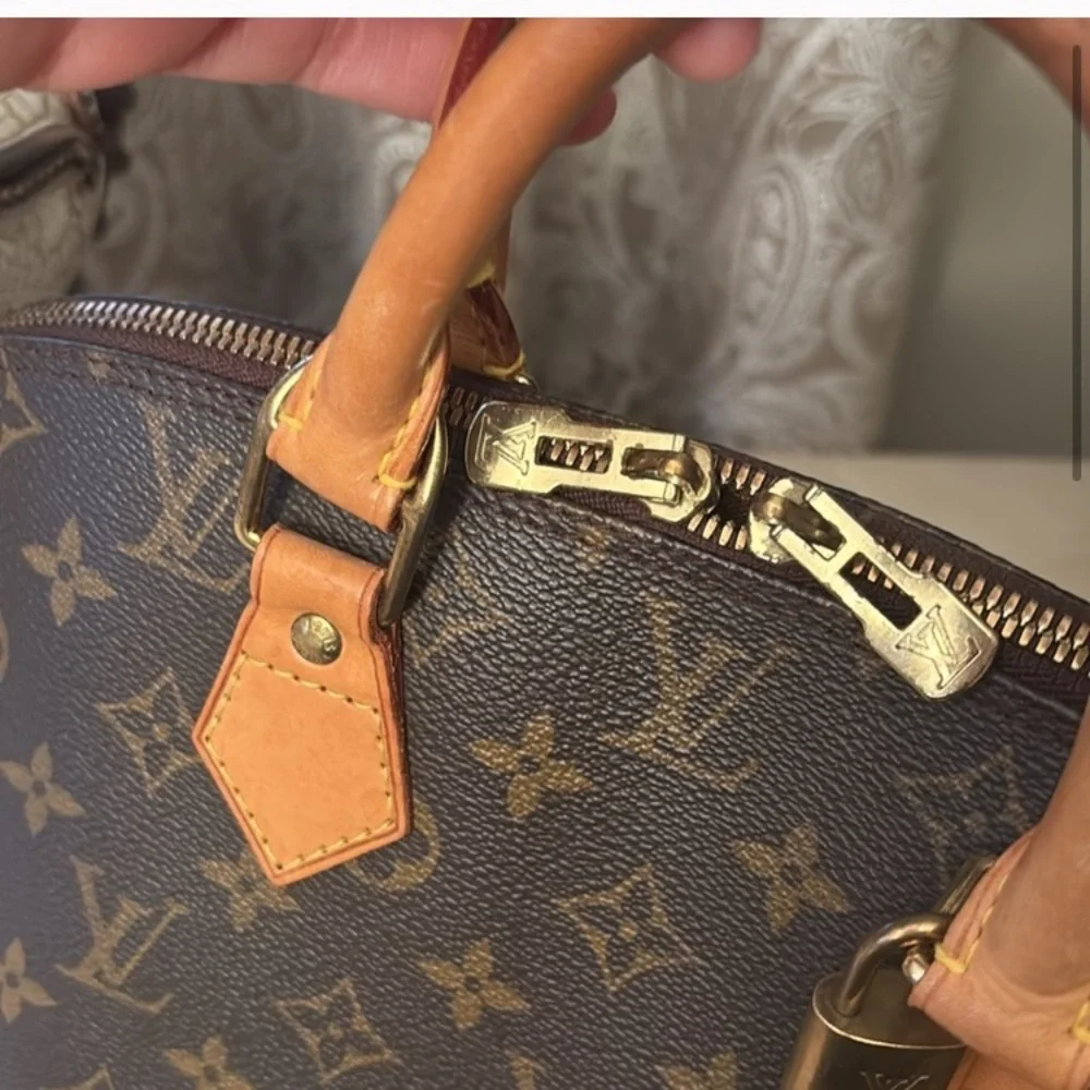 Louis Vuitton AlmaMonogram Handbag